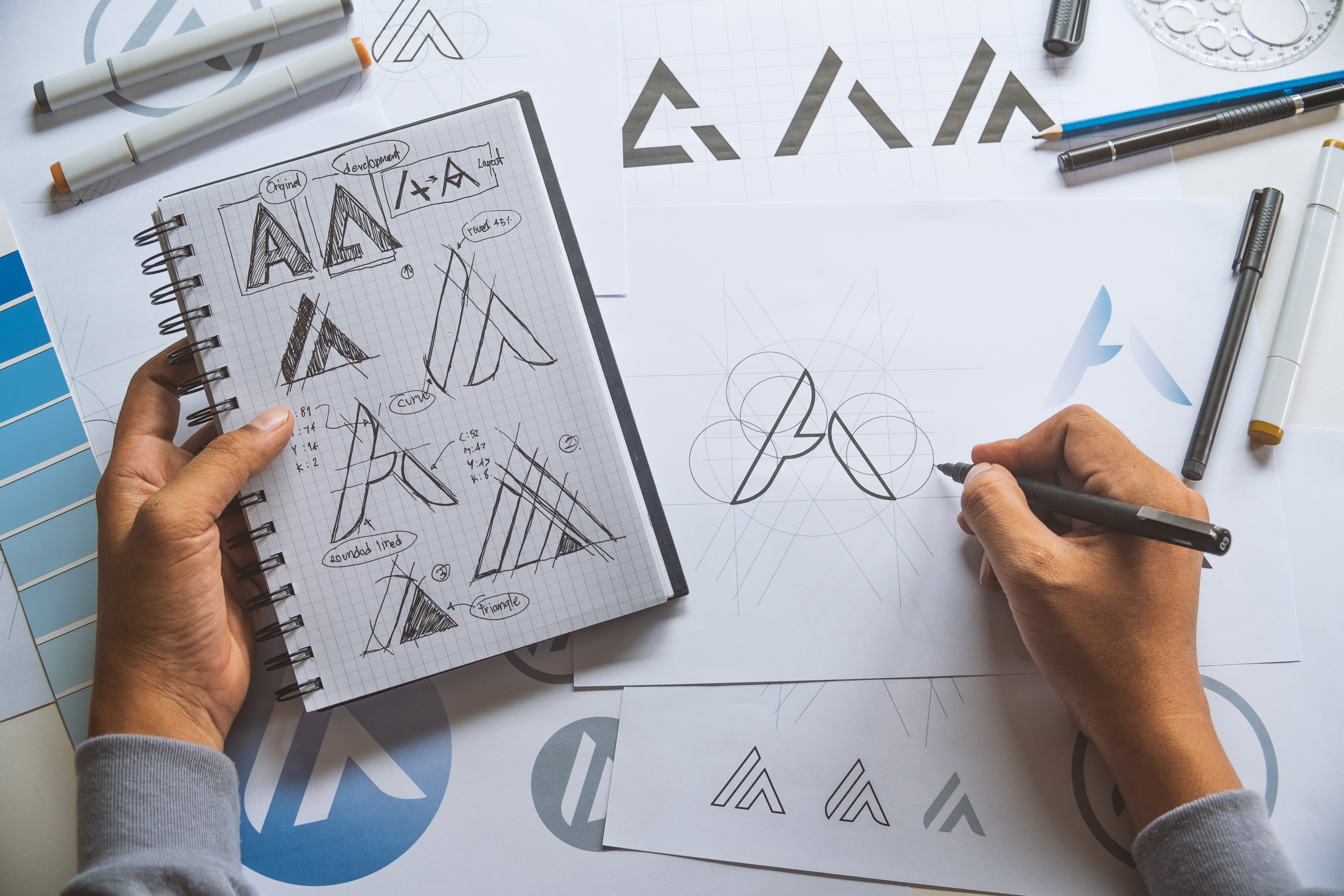 graphic designer sketching logo