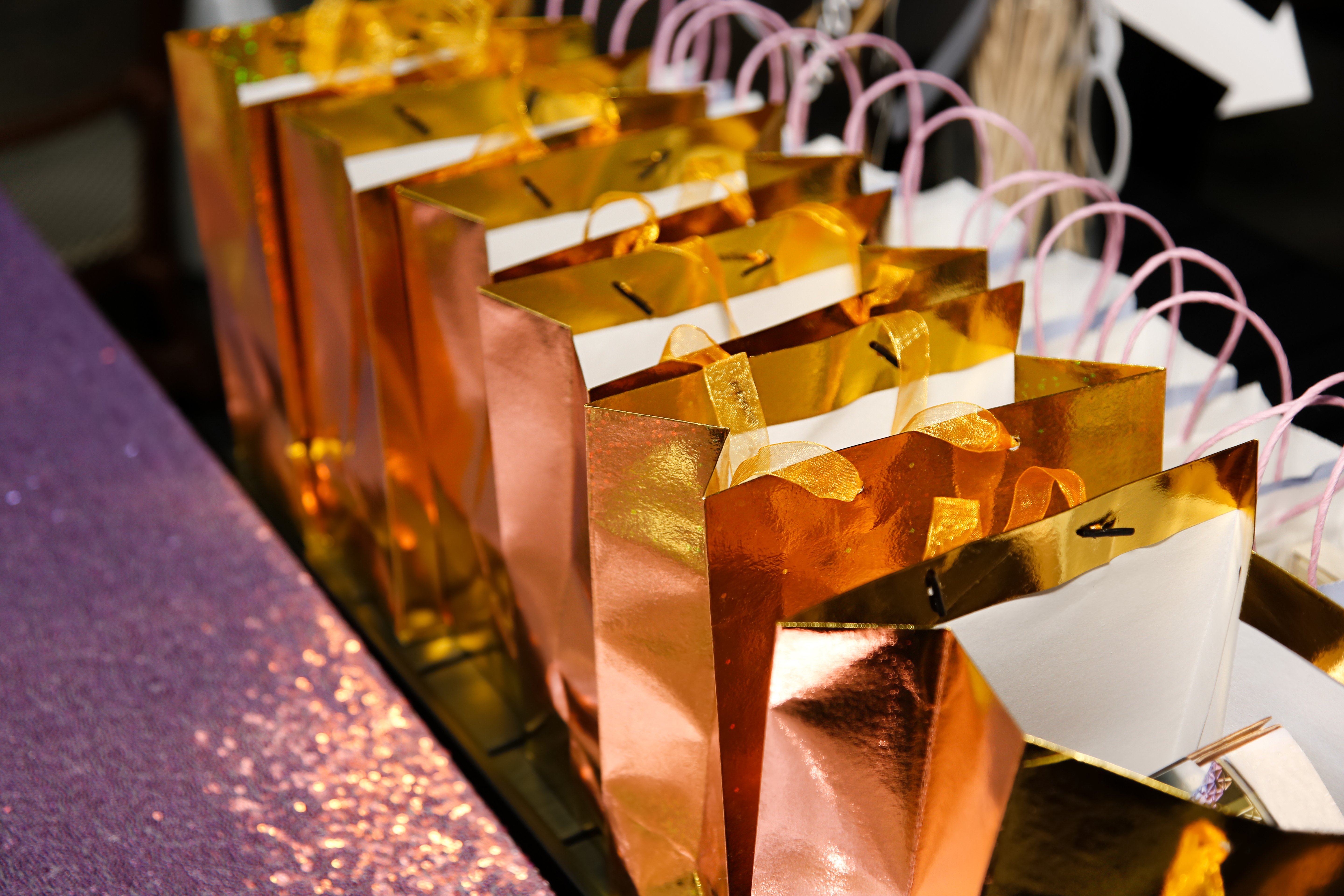golden goodie bags on reception table