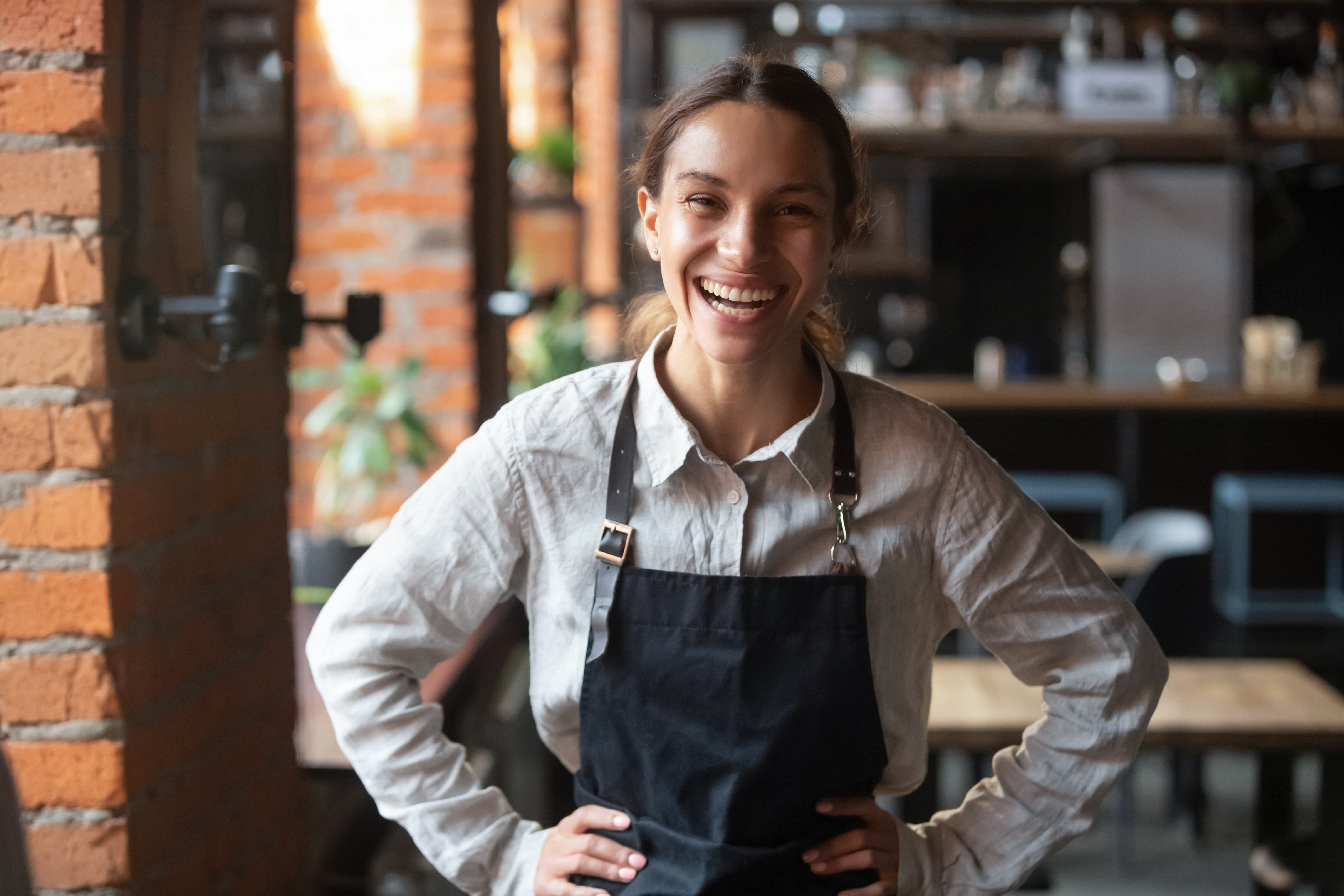 cheerful waitress wearing apron